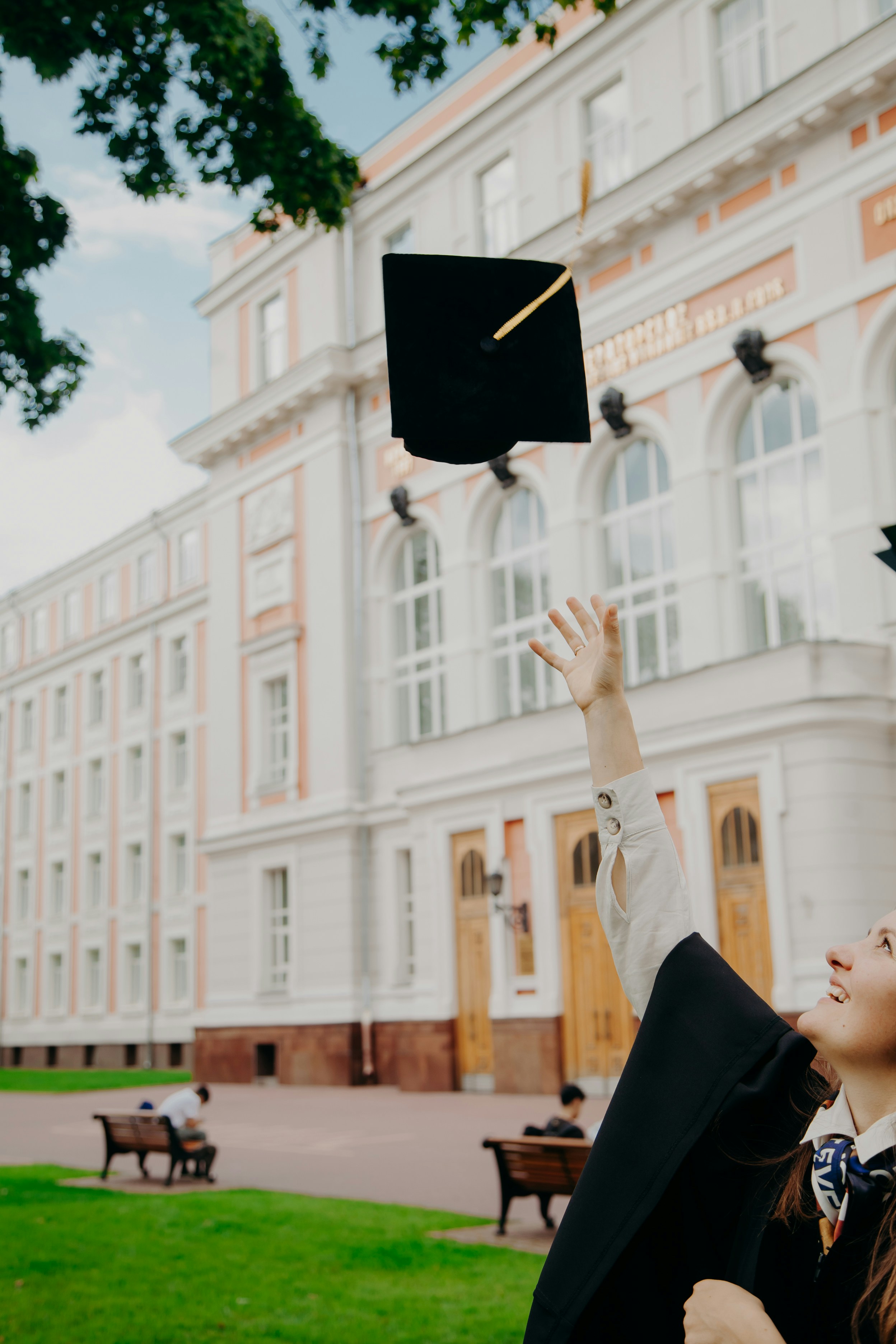 Graduate tossing cap in celebration
